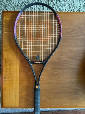 Wilson Black Tennis Racket with Purple and Orange Accents